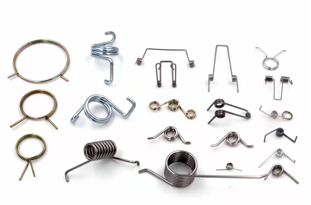 Manufacture of precision spring components for connector hardware
